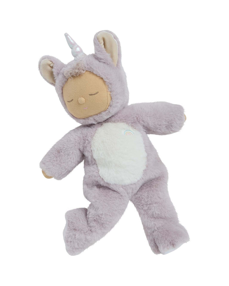 The Dinkum Dolls Cozy Dinkum Unicorn Sweetpea Lilac is a soft lavender stuffed animal with a unicorn costume, horn, ears, closed eyes, and white fuzzy belly, shown laying on a white background.