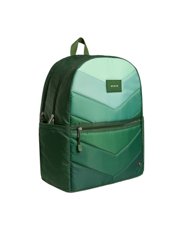 The Kane Kids Large Double Pocket Backpack in Olive Chevron by STATE Bags features organizational zip pockets, a front zip pocket, side pocket, and adjustable straps, shown against a white background.