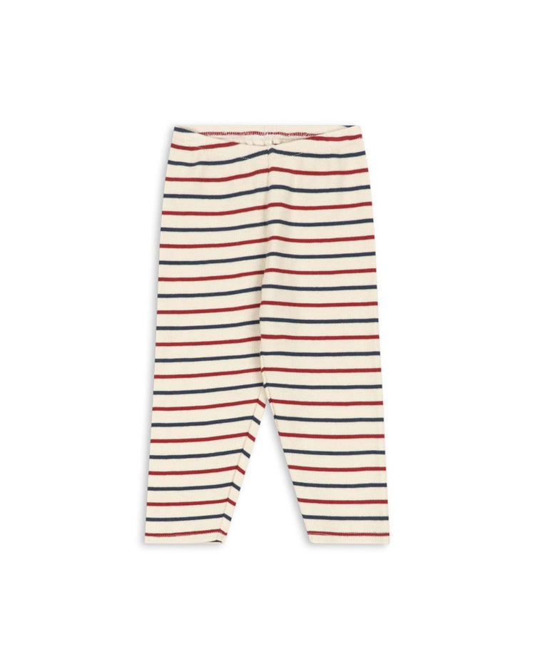 Voco modal pants in tricolore bleu by konges sløjd, featuring cream-colored baby leggings with horizontal black and red stripes, crafted from a soft modal blend for breathable comfort, displayed flat on a white background.