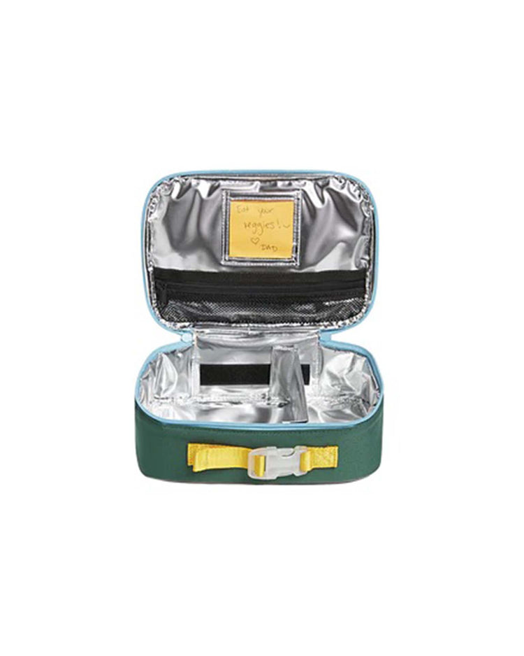 A rodgers lunch box in green + navy from STATE bags is open, displaying its silver insulated interior and a note inside that reads, "Eat your nuggets! - Dad.
