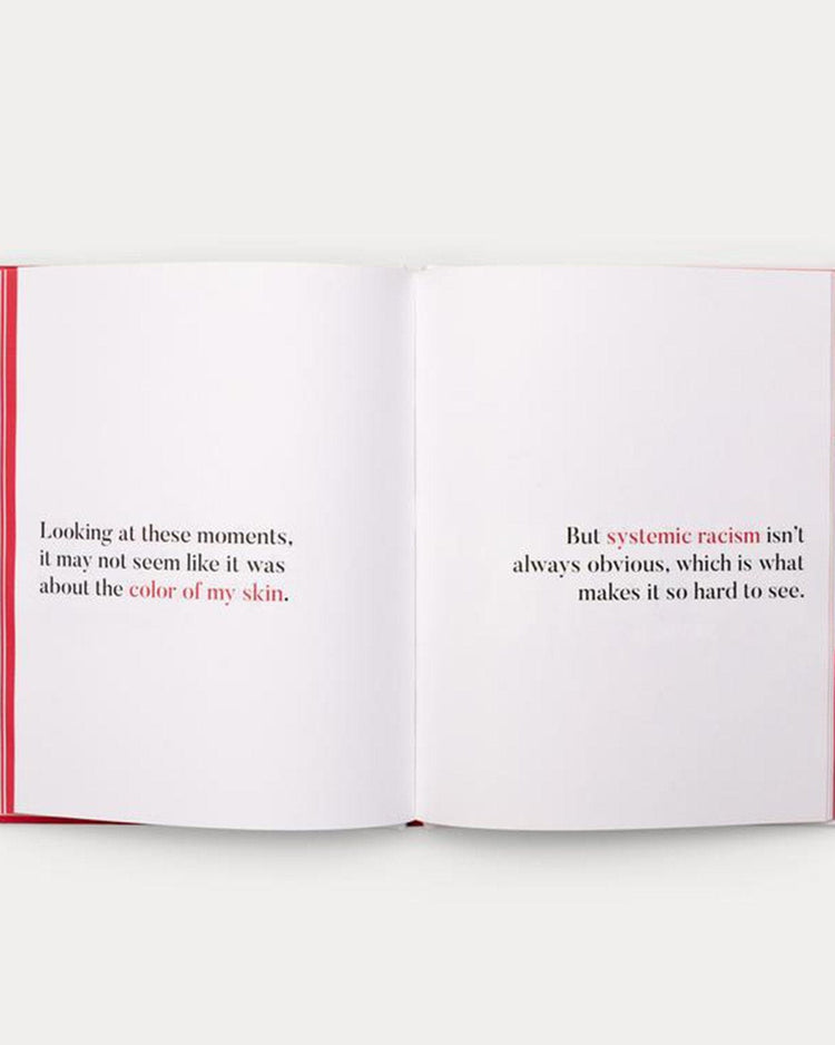 An open book reveals two pages of text discussing the challenges of recognizing systemic racism, mentioning how certain moments might not appear related to someone's skin color in a narrative style reminiscent of *a kids book about systemic racism* by Random House.