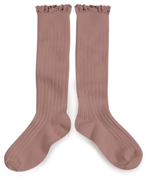 A pair of pink Collegien Joséphine Knee Socks in Praline de Lyon with ribbed texture and ruffle detail.