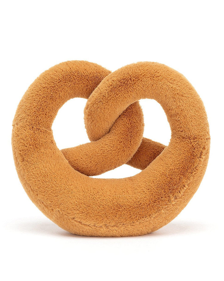 A soft, plush pretzel-shaped toy with a tan color, knitted texture, and a simple knot design, this amuseable pretzel huge from Jellycat makes for the perfect breakfast buddy, positioned against a white background.