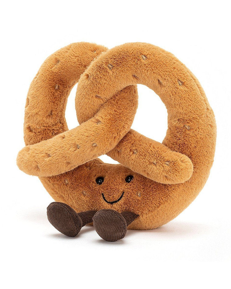 Meet the Amuseable Pretzel Huge by Jellycat: a plush toy shaped like a pretzel with brown spots, featuring a smiling face and small brown feet. Perfect as your new breakfast buddy or an adorable stuffed animal.