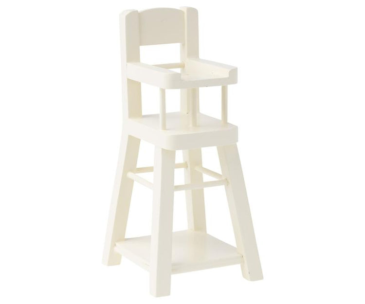 A white Maileg micro high chair on a white background.
