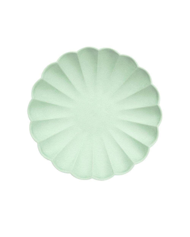 A Meri Meri simply eco small plate in mint with a scalloped edge.