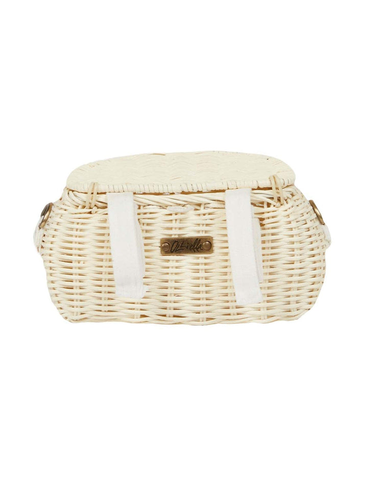 The mini chari bag in chalk by dinkum dolls is a small, oval woven basket with a lid, white fabric straps, natural light color, and a metal front label—perfect as a stylish scooter basket.