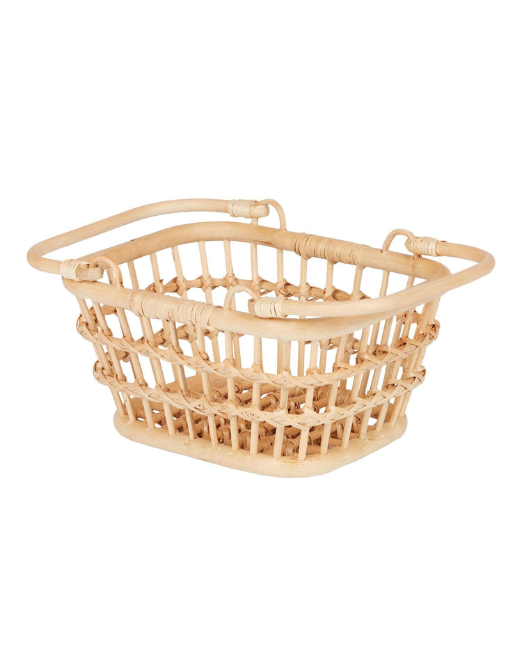 The tarry basket in wheat by dinkum dolls is a rectangular natural rattan basket with open sides, rounded edges, and two sturdy handles—ideal for kids’ storage. Shown in its natural color on a white background.