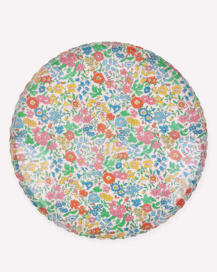 The meri meri x liberty round large accessory tray by meri meri features a vibrant, multicolored floral pattern with assorted small flowers and green leaves on a white background.