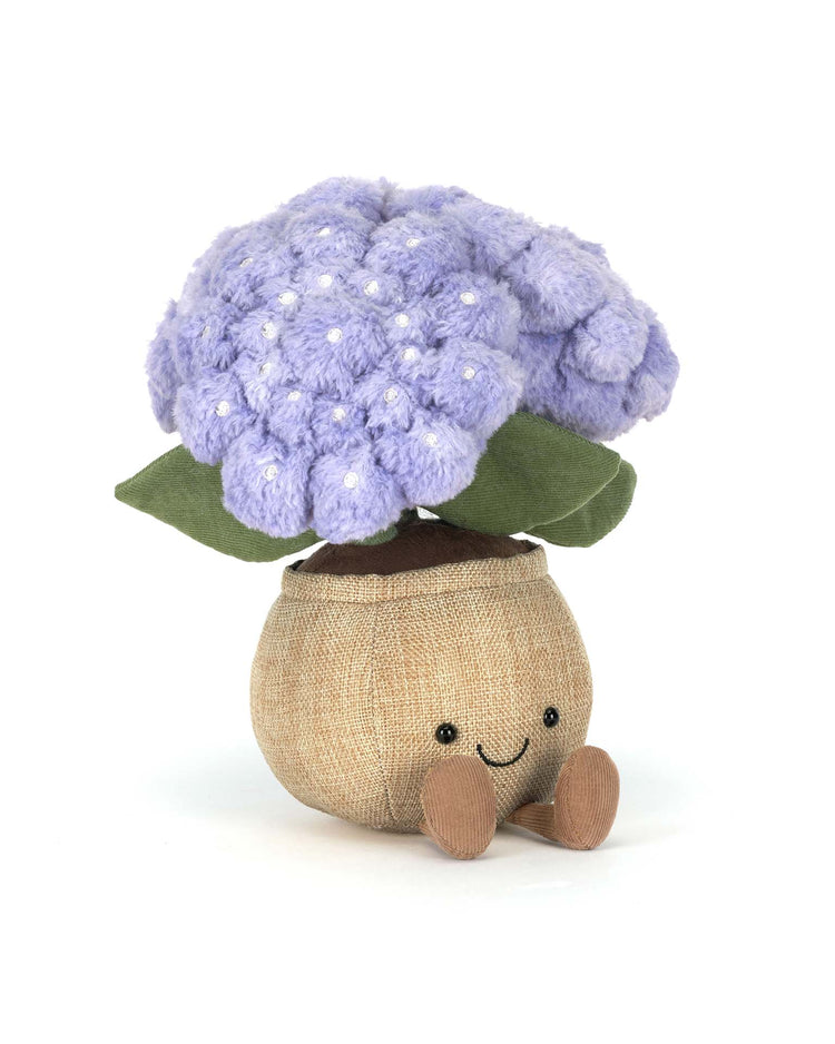 Jellycat's Amuseables Hydrangea is a plush toy shaped like a purple hydrangea with green felt leaves, a burlap pot, small brown feet, and a smiling face—perfect for any cottage garden toy collection.