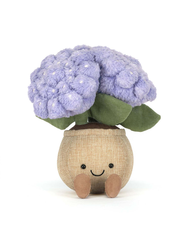The Jellycat Amuseables Hydrangea is a plush toy with soft purple hydrangea flowers, green leaves, and a smiling beige pot with little legs—perfect for cottage garden fans.