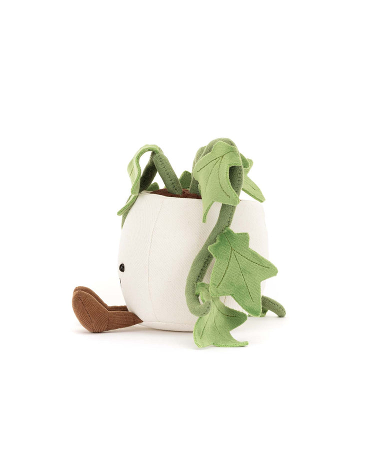 The Jellycat Amuseables Ivy is a cute plush shaped like a white plant pot, with brown feet, black eyes, and green fabric vines—an adorable gift for plant lovers.