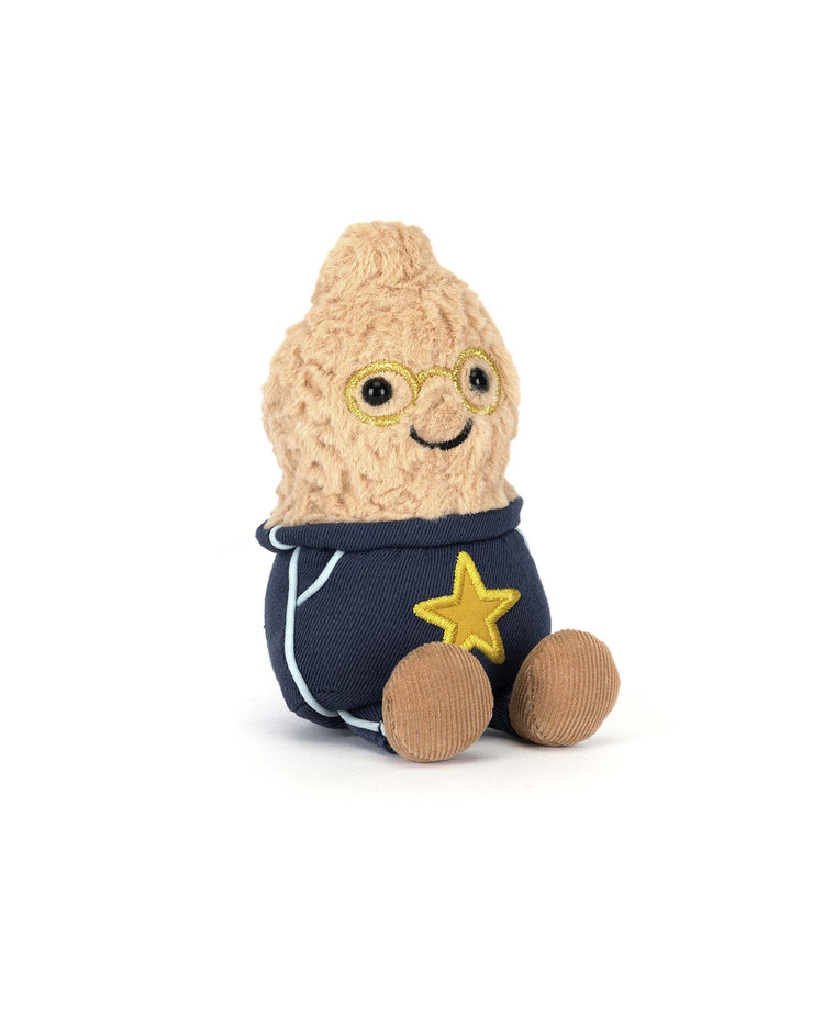 The Jellycat Amuseables Peanut Star Student Outfit plush features round glasses, a smiling face, and a navy blue outfit with a yellow star, shown sitting on a white background.