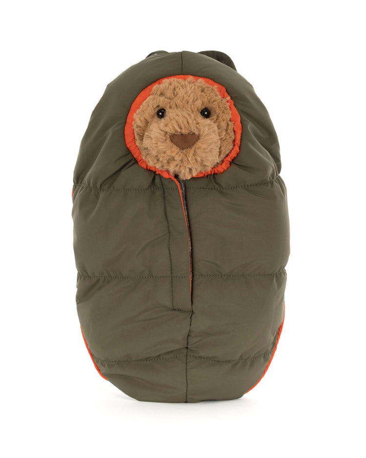 Bartholomew Bear by Jellycat wears a hiking outfit, featuring a teddy bear face peeking out from an olive green puffy sleeping bag with orange trim—like a bundled-up, adventurous bear.