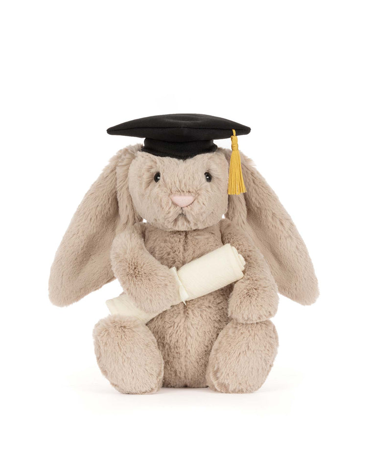The Jellycat Bashful Bunny Graduation Outfit features a plush bunny in a black cap with yellow tassel and holding a diploma—an adorable graduation gift.