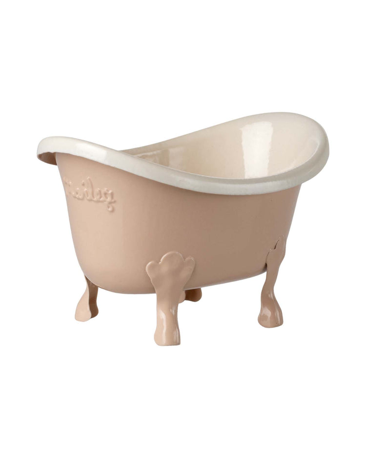 The maileg bathtub, mouse - rose is a small, pink ceramic clawfoot tub with a white interior, perfect as a charming vintage-style accessory for any mouse house furniture collection.