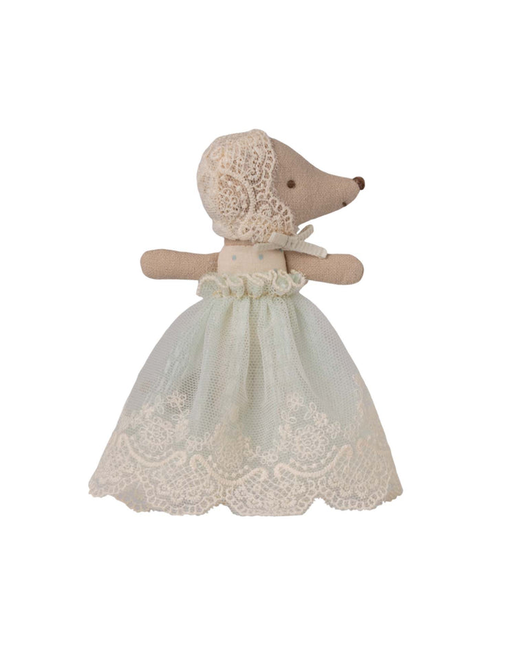 Maileg baby mouse in gown - mint, dressed in a white lace bonnet and a long, light blue cotton lace dress, stands with arms slightly outstretched on a plain white background.