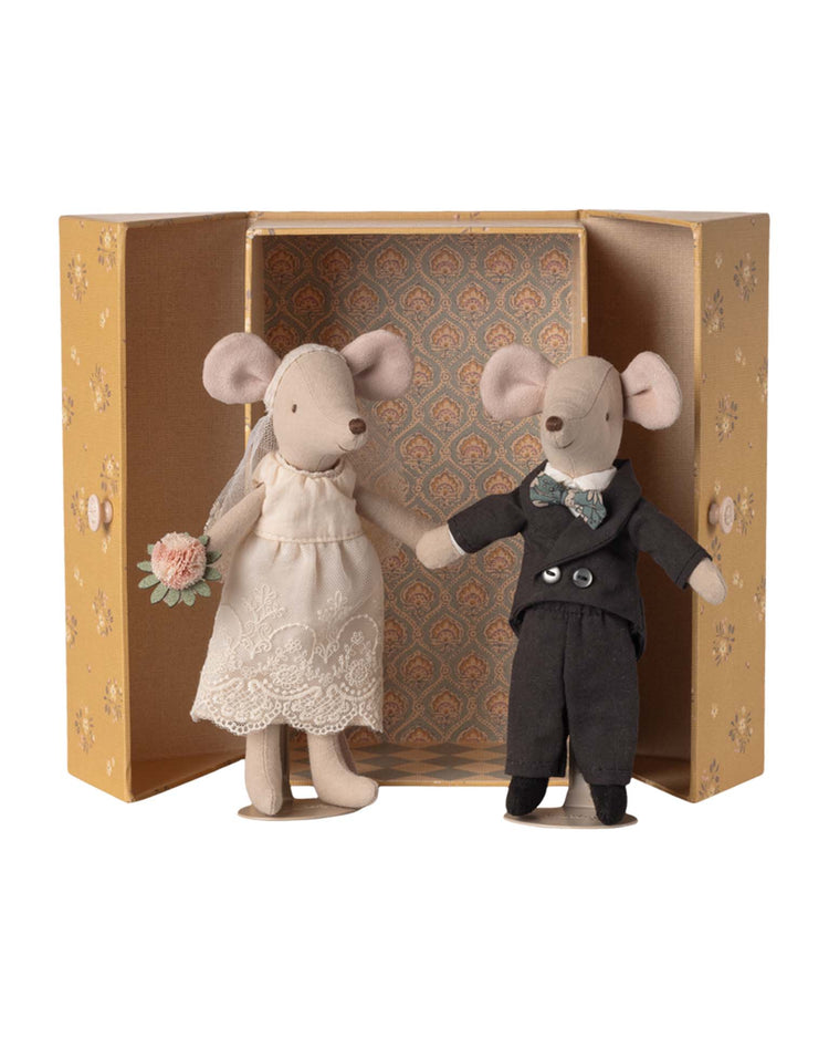 The maileg wedding mice couple in box, mum and dad, features fabric bride and groom mice holding hands in a decorative box—she wears a lace dress with bouquet, he wears a black suit—a charming wedding gift for any couple.