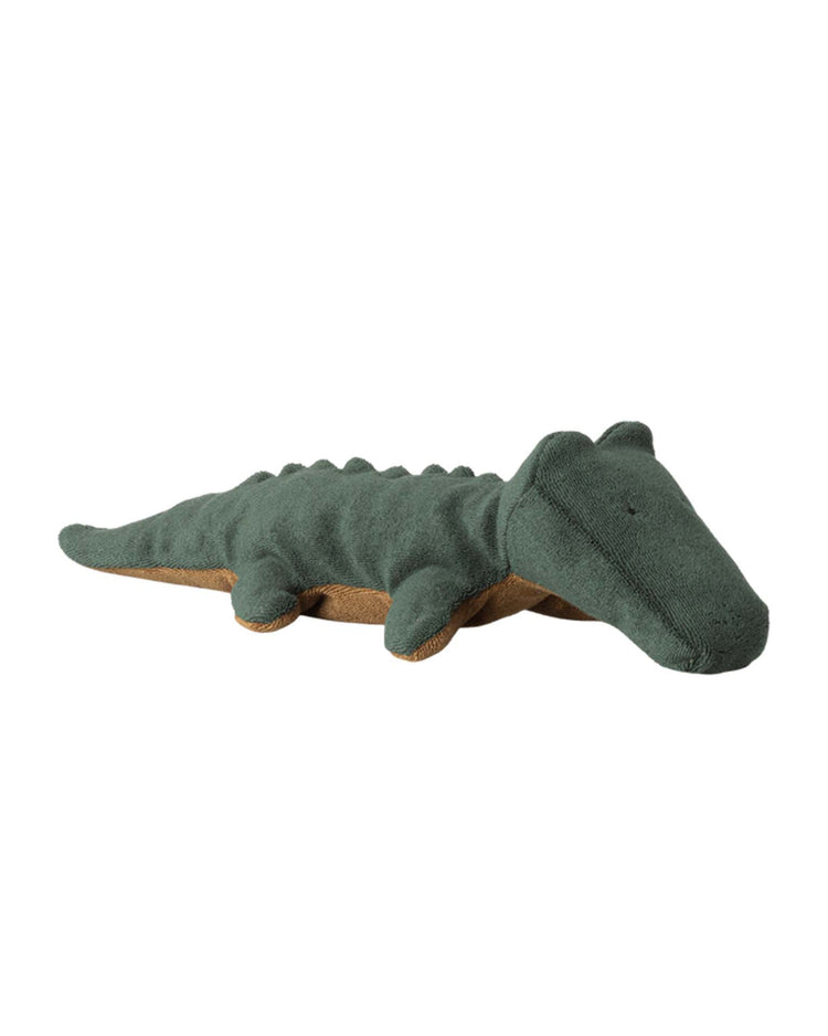 The maileg small crocodile in forest green, from the safari friends collection, is a cuddly plush with a rounded snout and brown underside—perfect for soft toy fans.