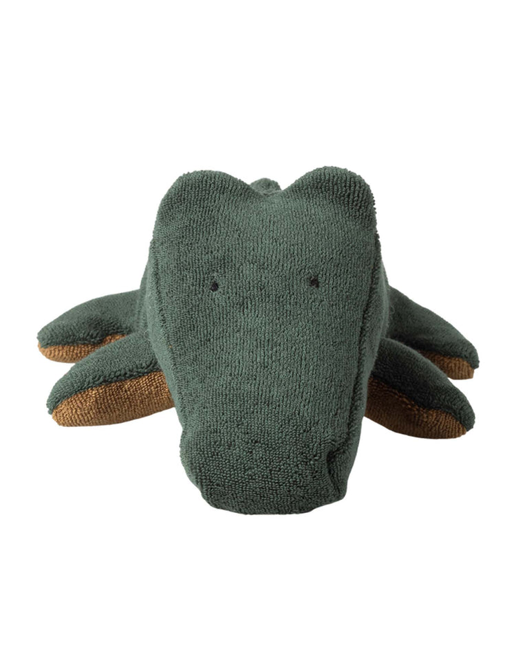 The maileg small crocodile in forest green, part of the safari friends collection, features soft, textured fabric with brown leg accents and simple black-stitched eyes—perfect for cuddling. Shown from the front.