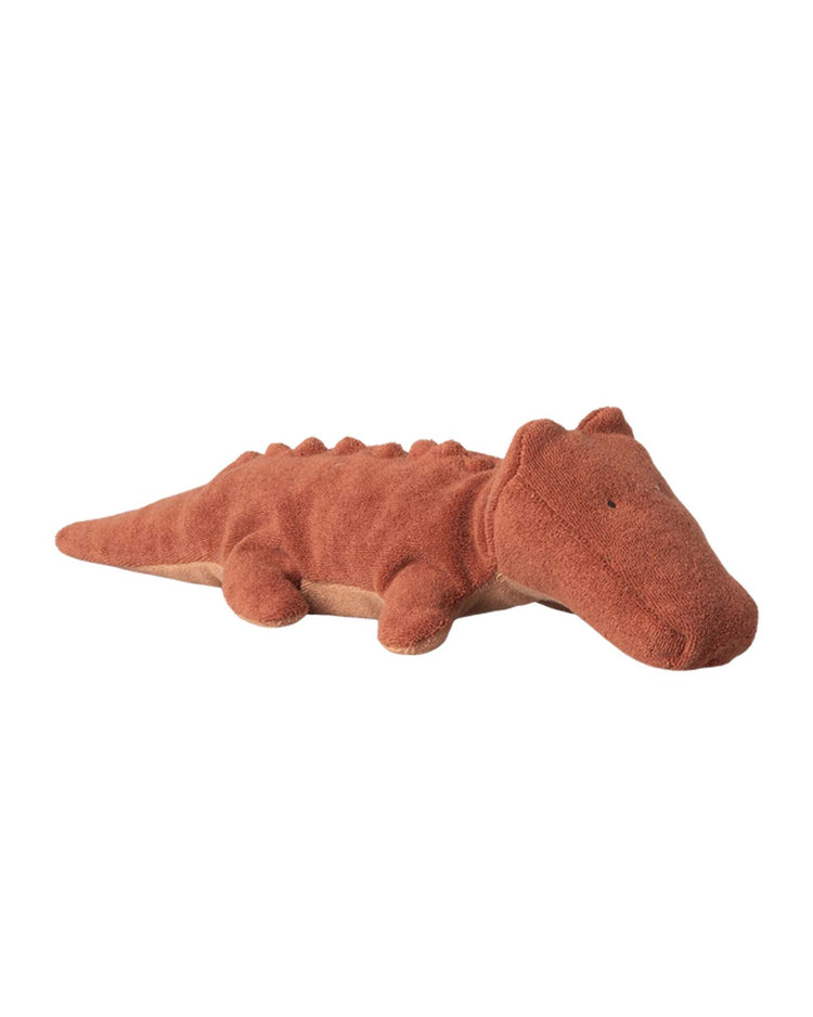 Meet the maileg small crocodile in vintage rose from the safari friends collection—a huggable plush toy made from recycled polyester with a minimalist face, rust color, and bumpy back—perfect for any soft toy collection.