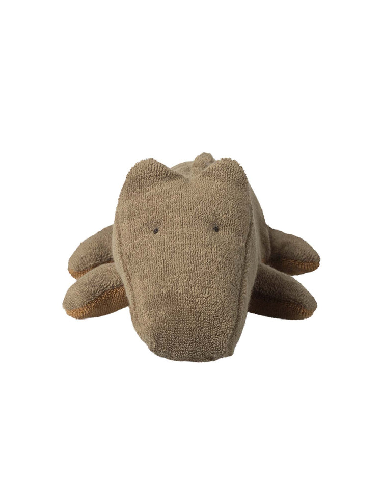 The maileg small crocodile in olive green from the safari friends collection is a huggable plush toy with simple stitched eyes, perfect for cuddles.