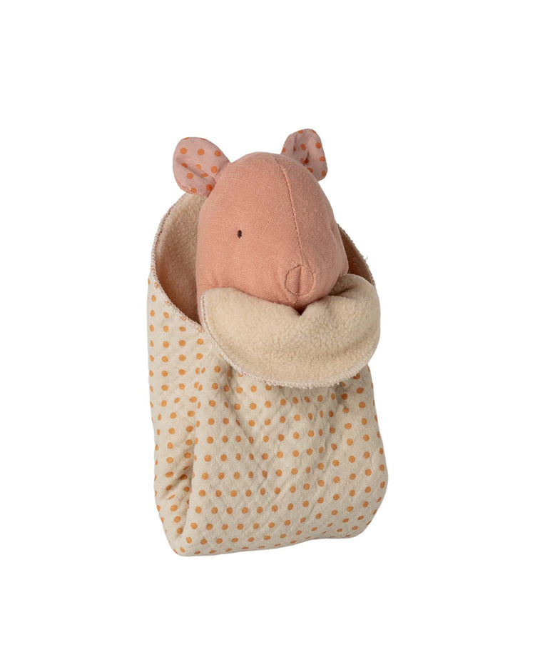 The Maileg lullaby friends pig, mini - rose is a soft pink stuffed toy with stitched features, nestled in a cream polka-dotted sleeping bag with a fuzzy cuff—a charming cuddle cloth or perfect newborn gift.