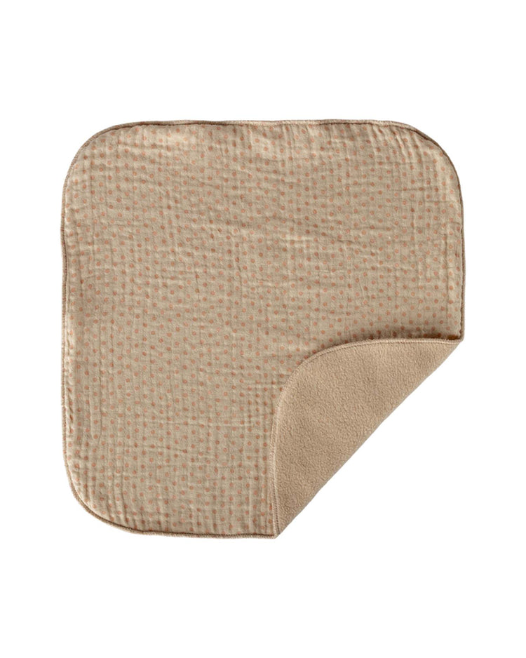 The lullaby friends, bunny, mini - nature by maileg is a beige, square cuddle cloth with rounded corners, subtle pink dots on one side and soft fleece on the other—one corner folded to show both sides; a perfect cozy baby gift.
