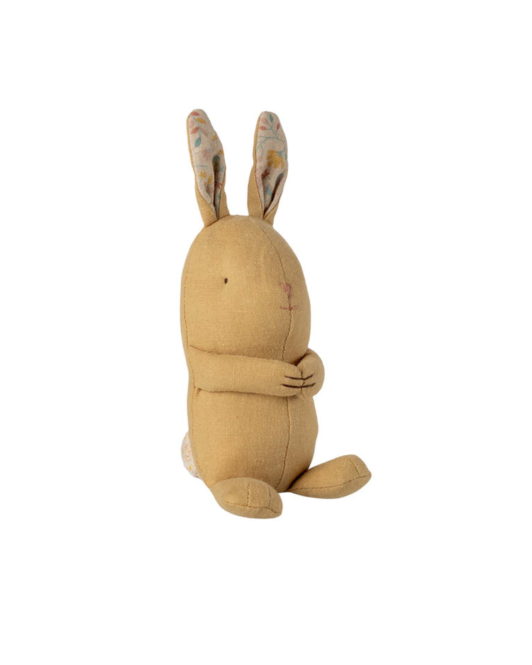 The maileg lullaby friends, bunny, mini in cream yellow features stitched facial details, patterned ears, and a small white tail—an adorable newborn gift—shown sitting upright against a plain white background.