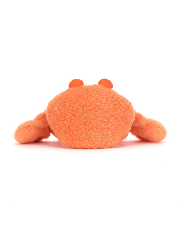 The jellycat pinchsnap crab is a fuzzy orange plush toy shaped like a crab, seen from behind with round eye stalks and wide claws—an adorable stuffed animal on a white background.