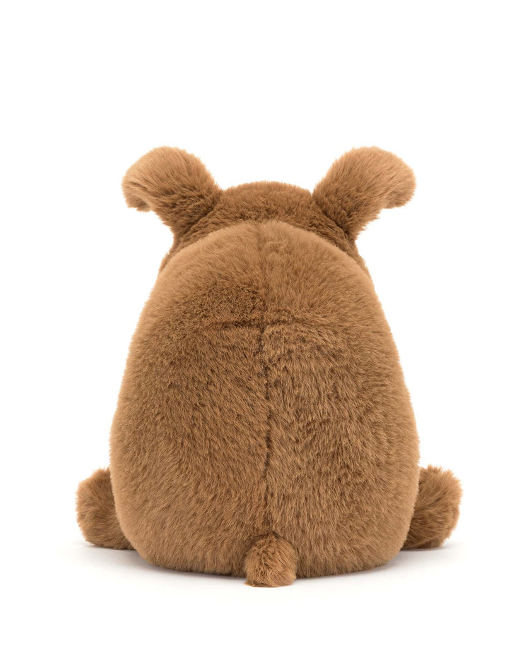 Derreck Dog by Jellycat is a plush brown stuffed animal with short ears and a small tail, sitting facing away on a white background.