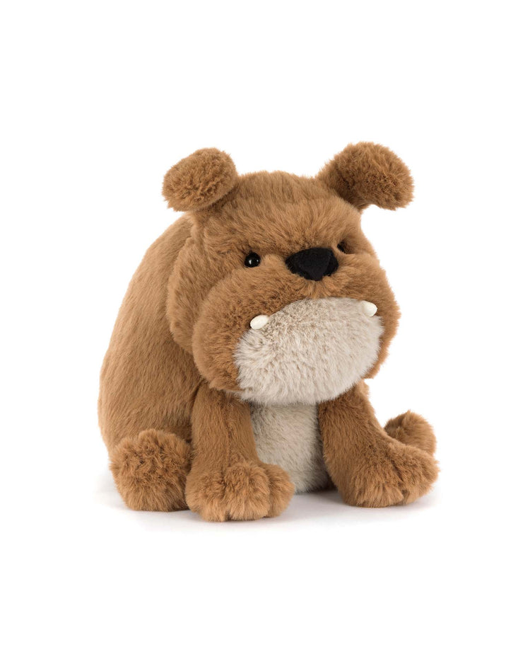Jellycat’s Derreck Dog is a brown and tan plush bulldog toy with round ears, short legs, and a white belly, sitting upright against a white background—an adorable companion ready for cuddles.