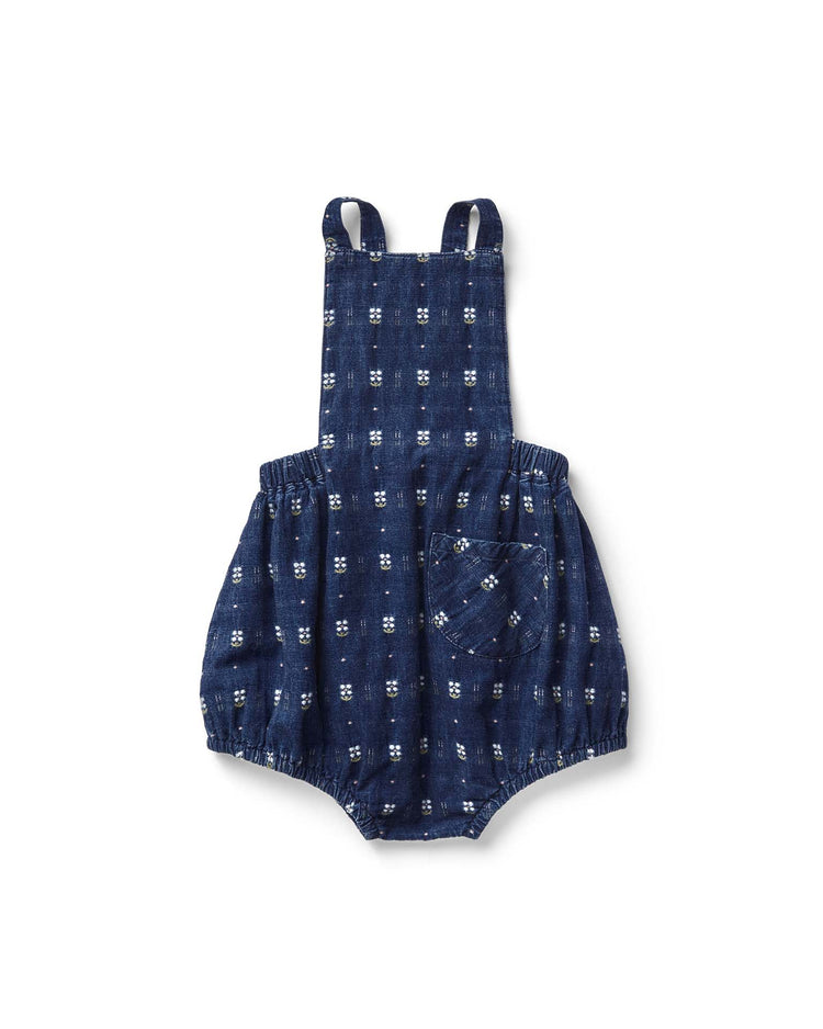 The oona romper by soor ploom is made in Portugal with a blue and white checkered cotton design. It features shoulder straps, elastic leg openings, and a front pocket, all showcased against a white background.