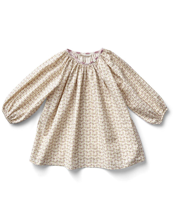 The peasant tunic in checker rose print by soor ploom is a charming, loose-fitting, long-sleeved baby dress crafted from cotton. With its colorful checkered pattern and gathered neckline, this adorable piece combines style and comfort effortlessly. Made in Portugal.
