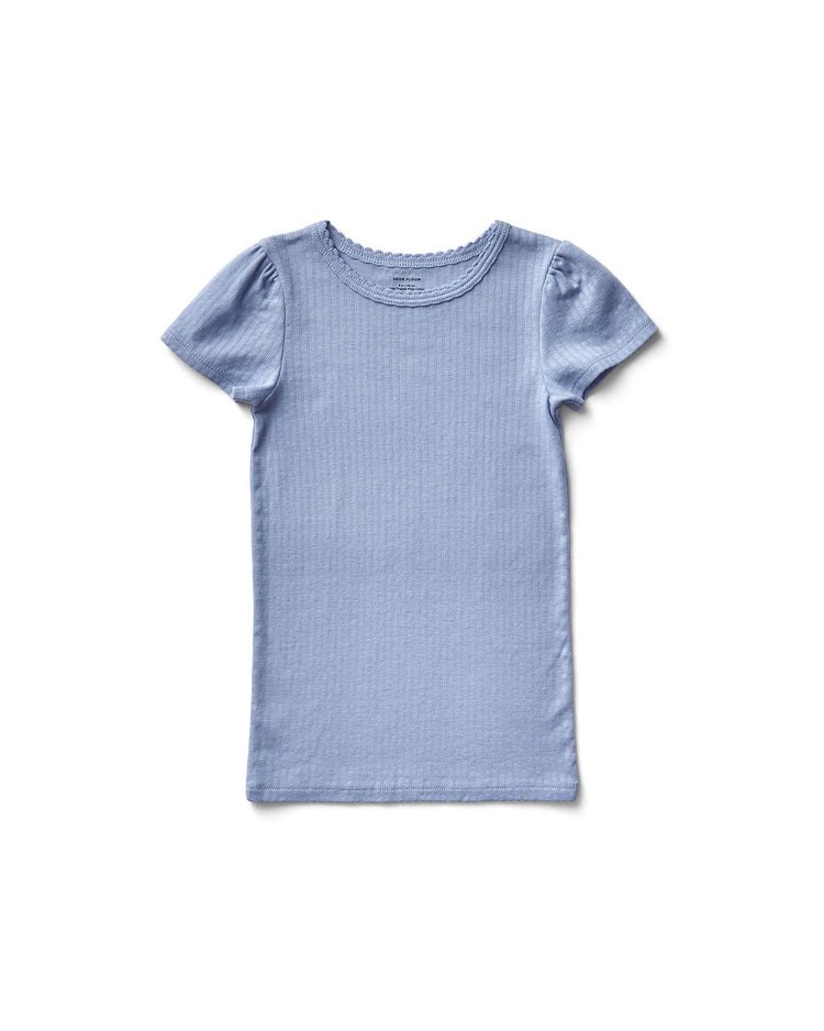 The pouf tee in sky pointelle by soor ploom is a light blue, short-sleeve T-shirt made with soft Peruvian cotton and features a round neckline on a white background.