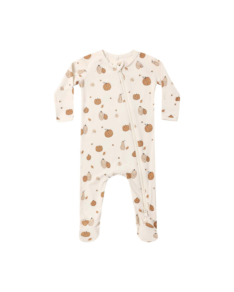The quincy mae bamboo zip footie in harvest friends is a cream-colored long-sleeve baby onesie with an angled zipper, adorned with a charming fall-themed print of pumpkins, leaves, and cozy mugs—perfect for comfortable and adorable baby sleepwear.