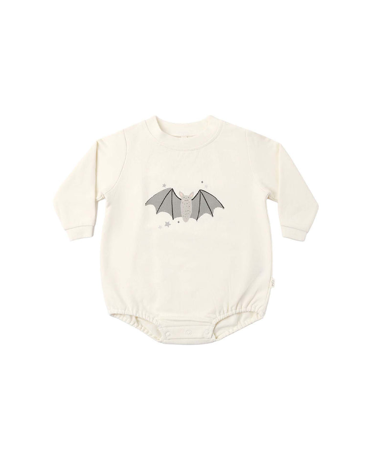 Introducing the crewneck bubble romper in baby bat by quincy mae—a cream-colored organic cotton baby romper with long sleeves, a cozy crewneck design, and convenient bottom snaps for easy changing. This adorable piece features a charming gray baby bat print with outstretched wings and tiny stars on the front.