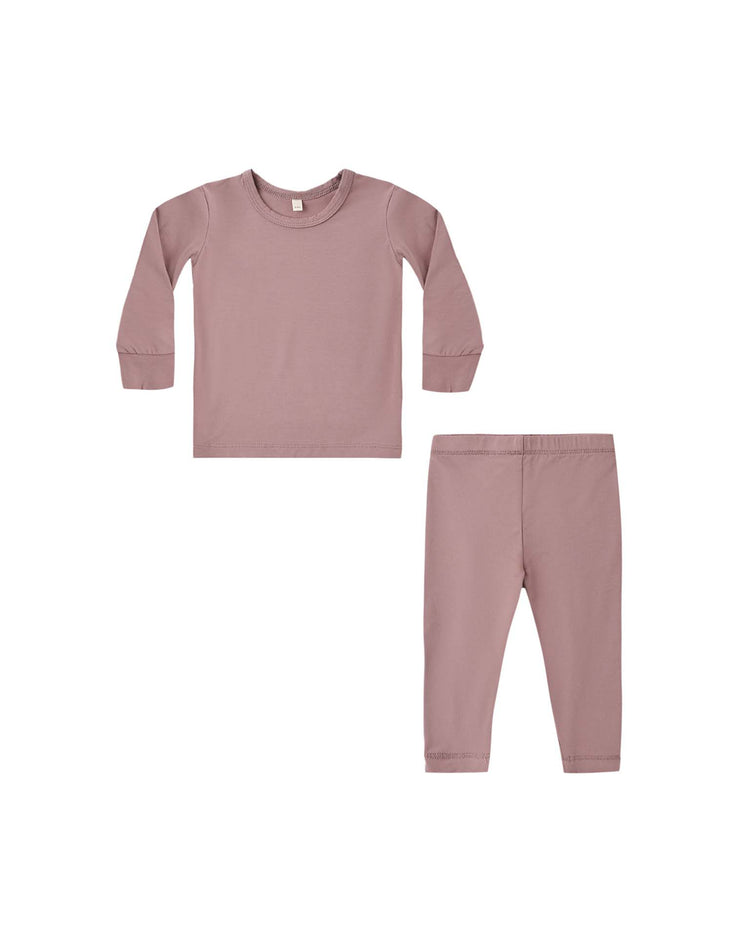 A matching set of children’s clothing in mulberry from quincy mae, featuring a long sleeve tee and leggings with ribbed cuffs and an elastic waistband. Both pieces are laid flat on a white background, creating the perfect bamboo pajama set for cozy comfort.