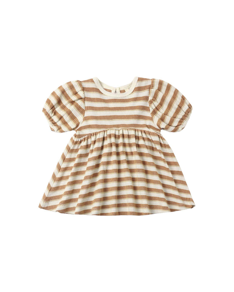 The darla dress in spice stripe by quincy mae is a short-sleeved, knee-length babydoll dress for babies, featuring beige and white horizontal stripes, a gathered waist, and gently puffy sleeves—crafted from soft organic cotton to ensure ultimate comfort.
