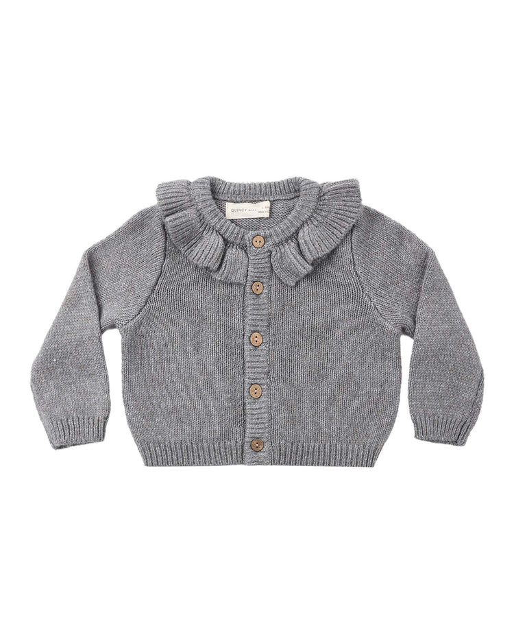 The ruffle collar cardigan in heathered slate by Quincy Mae is crafted from soft yarn with a touch of recycled polyester. This gray knitted baby cardigan features long sleeves, wooden buttons down the front, ribbed cuffs and hem, and a charming ruffled collar.