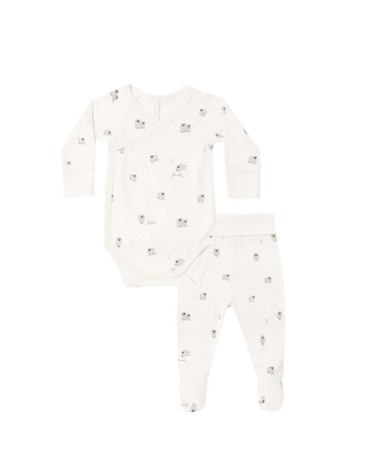 The quincy mae side snap bodysuit + pant set in sheep is pictured on a white background, featuring a soft long-sleeve wrap-style bodysuit and matching footed pants, both in white with delicate gray and beige sheep prints. Crafted from organic cotton, this baby set offers gentle comfort for delicate newborn skin.