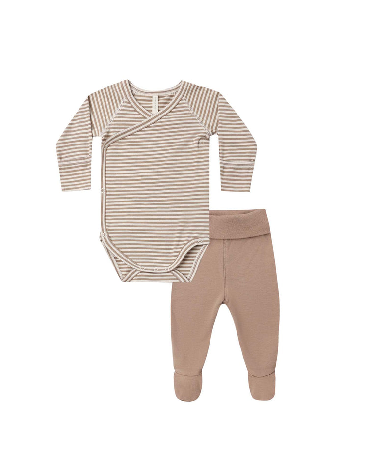 The quincy mae side snap bodysuit + pant set in almond stripe features a beige and white striped long-sleeve wrap-style newborn bodysuit paired with solid beige footed pants, both made from soft organic cotton, and displayed laid flat on a white background.
