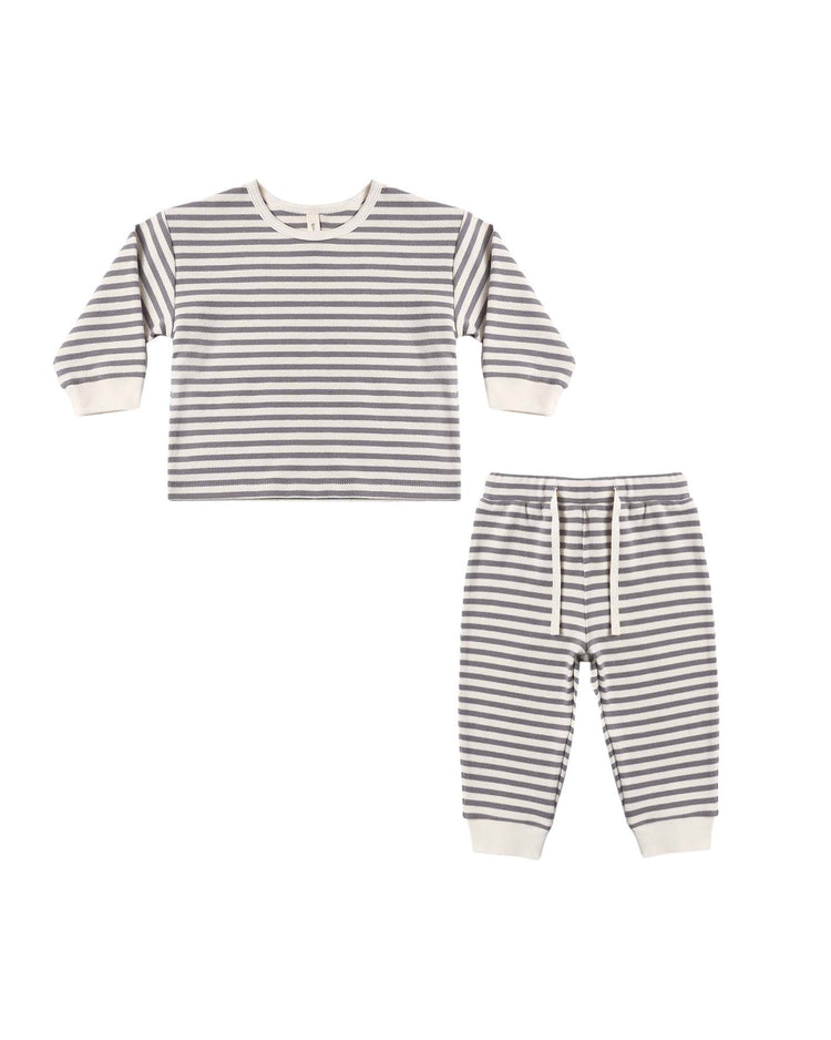 Quincy Mae's Cozy Set in Slate Stripe: A children’s pajama set featuring a long-sleeve gray and white striped top with matching drawstring pants and cuffed ankles, crafted from soft organic cotton, shown on a white background.
