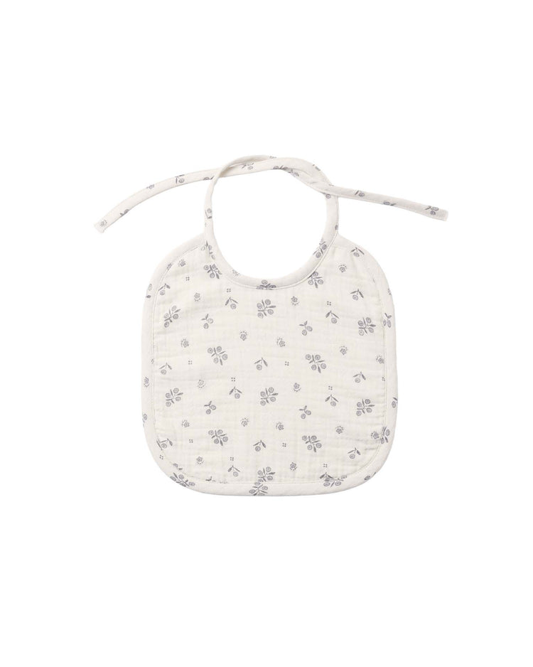 Quincy Mae woven tie bib in winter berry, a white lightweight baby bib featuring a simple gray winter berry print and a tie closure, displayed on a plain white background.