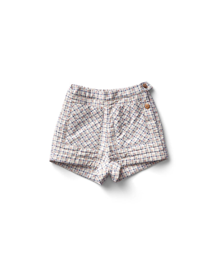 The Soor Ploom Quinn short in checker rose print, blueberry, is a high-waisted cotton design featuring front pockets and two button closures on the waistband.