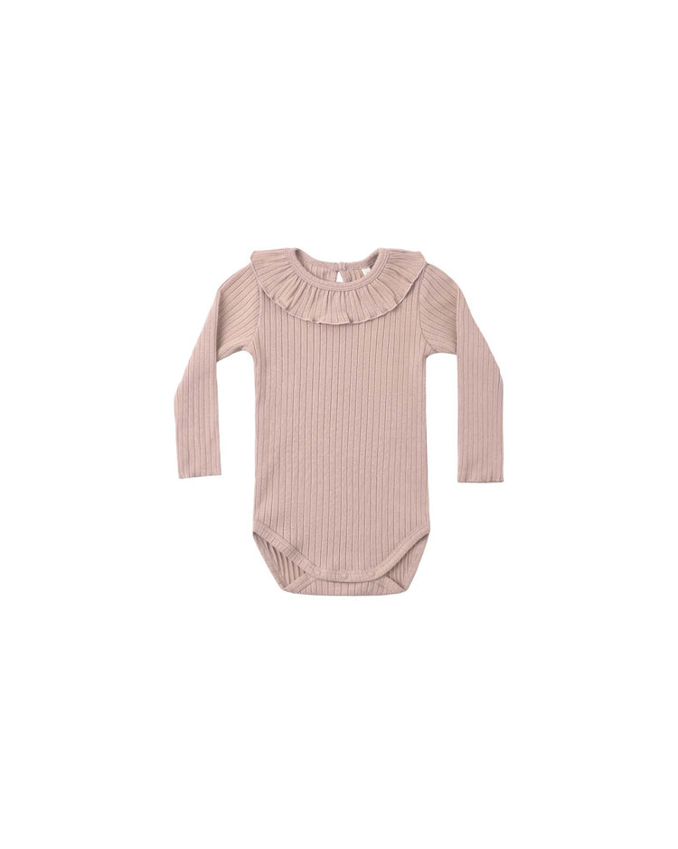 The PREORDER ruffle collar bodysuit in rosewood by rylee + cru features a ribbed knit texture and an adorable ruffle collar. Displayed flat on a white background, this long-sleeve piece combines comfort and delicate style for your little one.