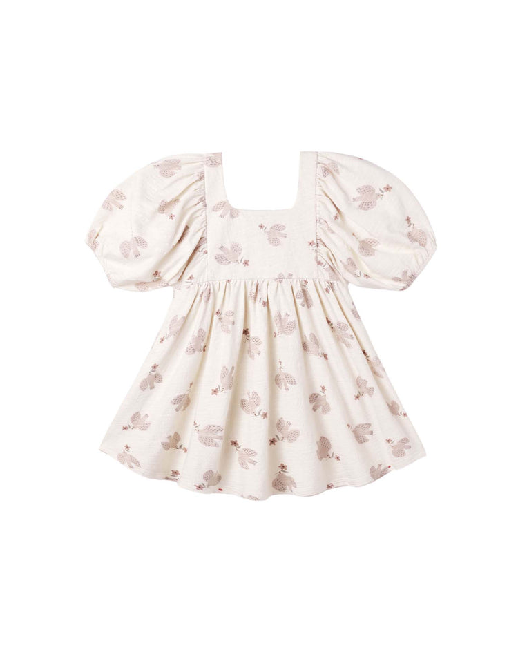 PREORDER the brea dress in sparrows by rylee + cru—a cream-colored mini dress with a square neckline, subtle floral print in light pink and beige tones, crafted from cotton. Featuring a flared skirt, gathered bodice, and balloon sleeves, this dress offers a charming and feminine silhouette.