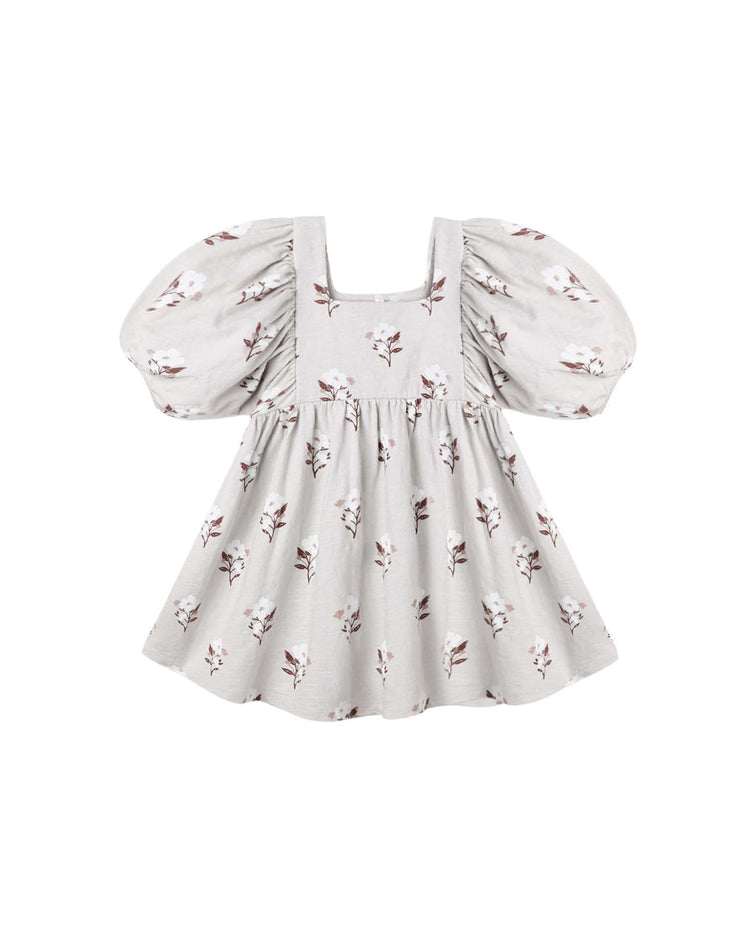 The brea dress in wildflower by rylee + cru is a light gray mini dress crafted from 100% cotton, featuring puffed sleeves, a square neckline, and a muted wildflower print.