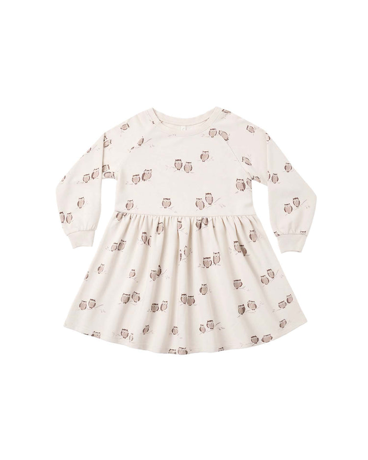 The PREORDER raglan dress in owls by rylee + cru is a cream-colored, long-sleeve toddler mini dress featuring a gathered skirt and an all-over small brown owl print. The dress is shown laid flat against a white background.