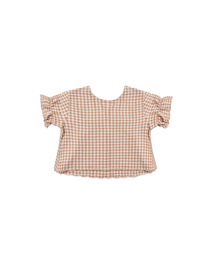 The rylee + cru francie blouse in fawn gingham is a brown and white gingham short-sleeve top featuring ruffled sleeves and a cropped fit, shown flat against a white background.